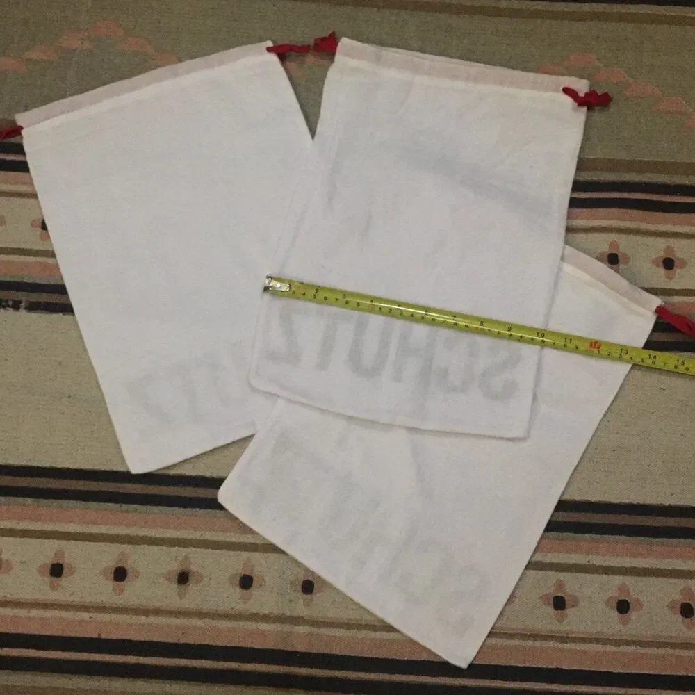 Three (3) Schutz white w/ black lettering soft material Dust bag 15” x 10”